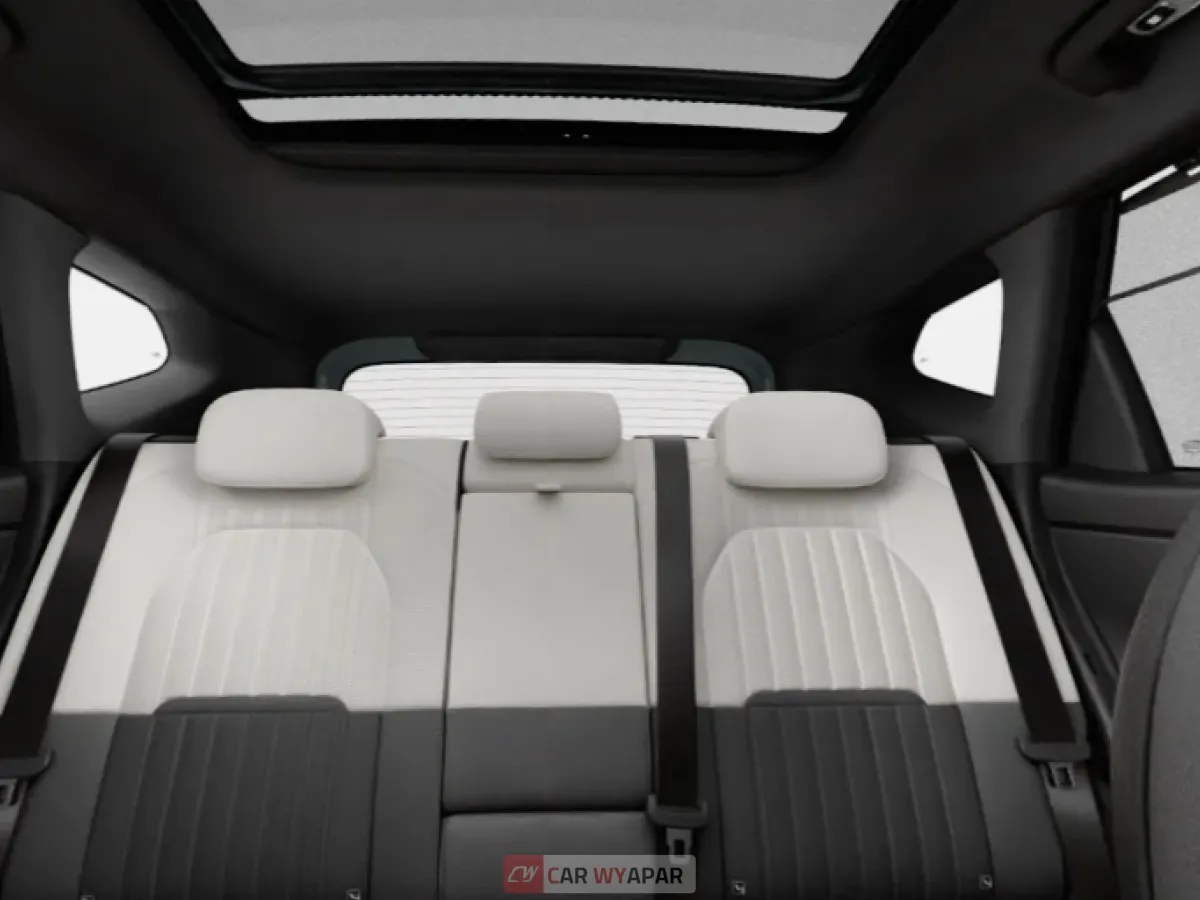 Interior view of the rear seats in a Seltos GTX, showcasing dual-tone white and black upholstery.